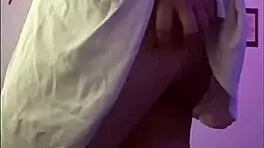 Young 18+ wife with tattoo touches herself with vibrator in homemade scene, focusing on big tits and ass