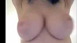 Blue haired 18yo shows off her huge breasts on webcam