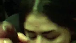 Young woman in dorm gives interracial blowjob