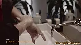 Does the stepmom strap on to fuck the teen in this lesbian threesome?