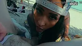 Friends Engage in Intimate Activities on Crowded Beach