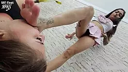 The bad teen 18+ brunette licks the latina's pink feet in domination fetish.