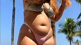 Shy beach encounter turns wild as stranger slaps ass and exposes cock for thrilling oral surprise.