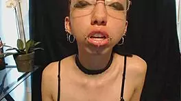 Goth Girl Applies Lipstick and Drools Playfully