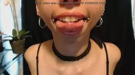 Goth Girl Applies Lipstick and Drools Playfully