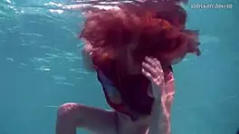 Redhead Nikita Vodorezova Takes A Quick Bath Underwater