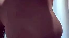 woman caresses her milky tits until she orgasms