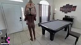 strong powerful woman lifts and carries petite blonde