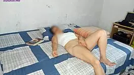 Young Latina cleans room while stepfather works outside