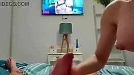 My busty girlfriend assists with relaxation while watching television.