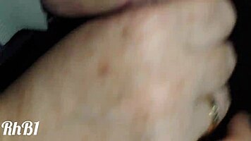 redhead milf gives handjob to big cock in homemade closeup