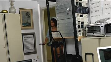 The dirty girl eagerly sucks her manager's massive black cock right in the office.