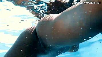 With her clothes set aside, Yorgelis seduces the producer by the pool underwater.