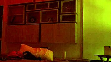 Linda Houston dances seductively under the full red light, captivating everyone with her moves