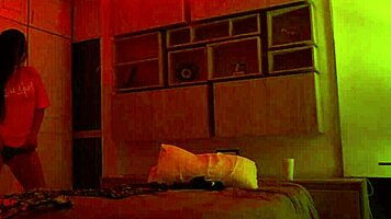 Linda Houston dances seductively under the full red light, captivating everyone with her moves