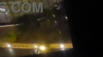 sharing private pleasure outdoors by hotel window