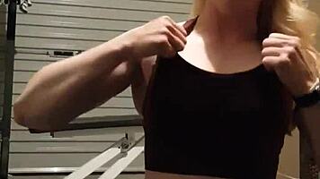 Muscular blonde milf teases in gym, undressing leggings for striptease