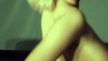 Bright eyed cutie mandy dee strips naked on couch teasing big tits