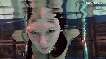 Katya Okuneva is at the pool, bouncing her tits in a dress and bikini