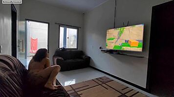 Teen brunette plays videogame on guy's lap, discovers huge interracial cock leading to amateur orgasm
