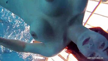 redheaded katrin teasingly stripping underwater 😏