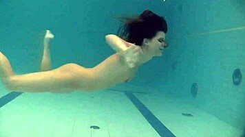 Natalia Kupalka swims naked in the pool, looking cute