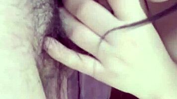 girlfriend on the balcony teases by playing with her wet pussy