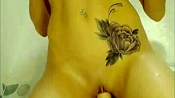 cute girl uses dildo in shower