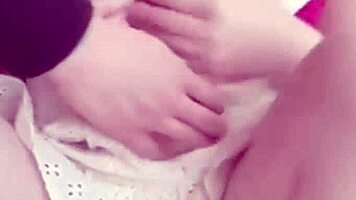 girlfriend on the balcony teases by playing with her wet pussy