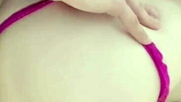 girlfriend on the balcony teases by playing with her wet pussy