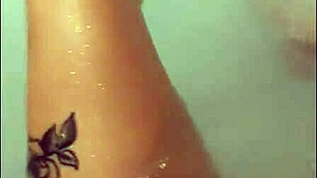 pretty woman enjoys solo masturbation in hot tub