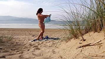 i filmed a curvy milf changing clothes and exercising naked on the beach