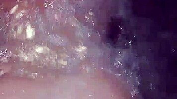 Sexy milf aggressively fucks her young boyfriend in the hot tub, showing off her big tits and ass.