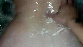 Sexy milf aggressively fucks her young boyfriend in the hot tub, showing off her big tits and ass.