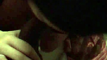 Young woman in dorm gives interracial blowjob