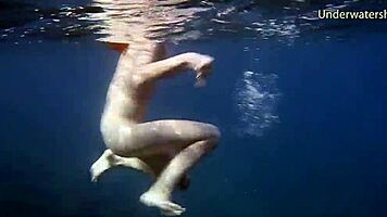 In Tenerife, Hot Ginger Teen 18+ Swims Underwater, Showing Off Bikini in Public Pool Scene