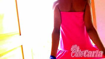 Petite amateur Carla teases with a slow strip, revealing tight body
