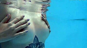 nude swimming in the pool babe with tattoos mimi cica