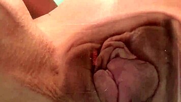 Look at this petite teen rubbing her pussy on the glass table.