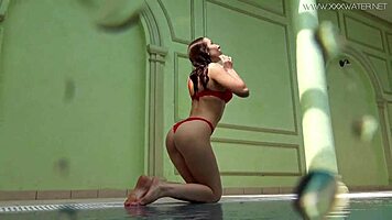 Lina Mercury shows big tits underwater in pool