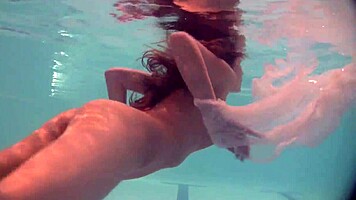 Russian Babe Natalia Swims And Strips