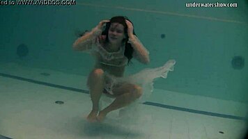 Russian Babe Natalia Swims And Strips