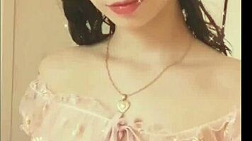 Kawaii woman shows her natural tits in the bedroom