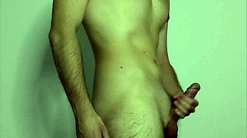 On webcam, a young amateur massages her cock to masturbation climax.