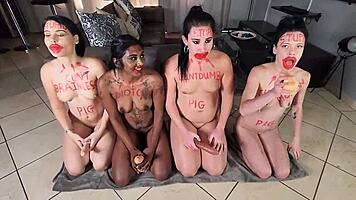 four silly sluts in red lipstick gagging on dildos and getting saliva facials together
