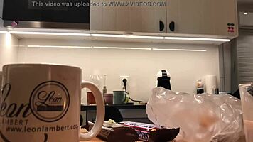 Young amateur wife does dishes while voyeur cam captures her in tight leggings and thong