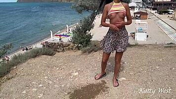 peeing publicly near beach with crowd watching