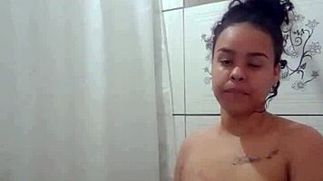 Enjoying a hot shower while fingering my tight pussy