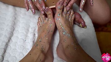 Two cute teens with shiny legs tease huge rubber cock in footjob play, amateurs explore toys