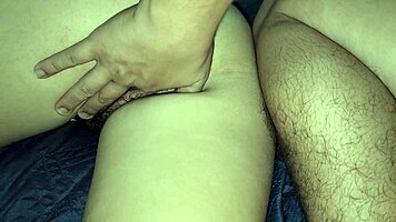 Curly Brunette Masseur Provides Relaxing Oral Massage To Client On Desk